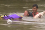 Dramatic video shows woman and her dog being rescued from sinking car